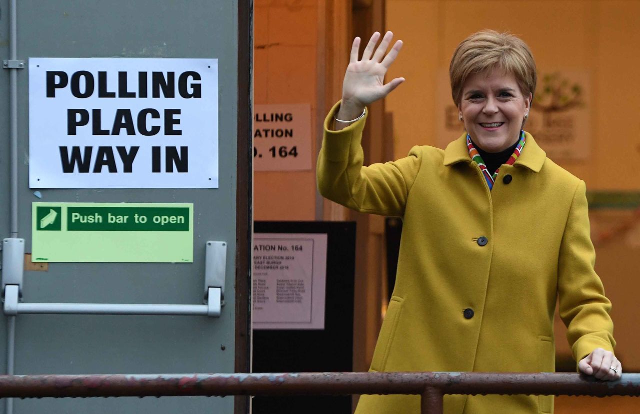 Scotland's First Minister and leader of the Scottish National Party (SNP), Nicola Sturgeon, waves outside a polling station in Glasgow, Scotland. Photo: Andy Buchanan/AFP via Getty Images