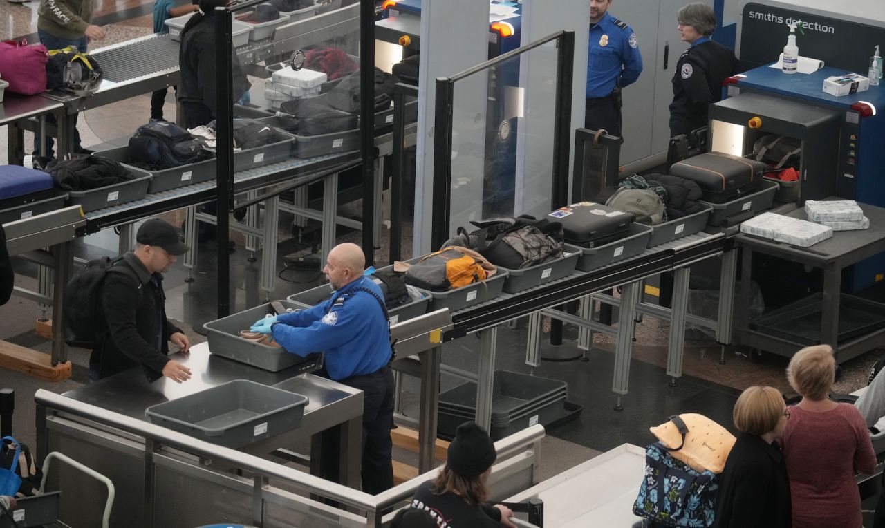 Carry-on baggage is scanned at a security checkpoint at Denver International Airport on Monday.