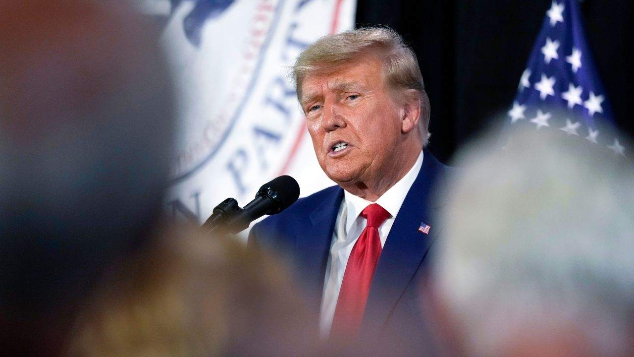 Former President Donald Trump visits with campaign volunteers at the Elks Lodge in Cedar Rapids, Iowa, in July. 