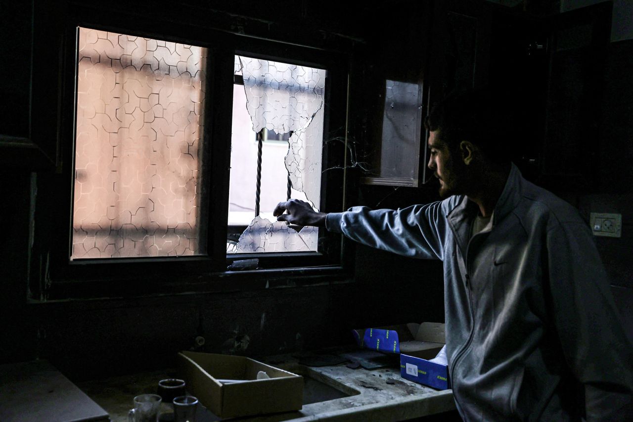 A Palestinian inspects the damages after an Israeli raid in the occupied West Bank town of Tubas on November 28.