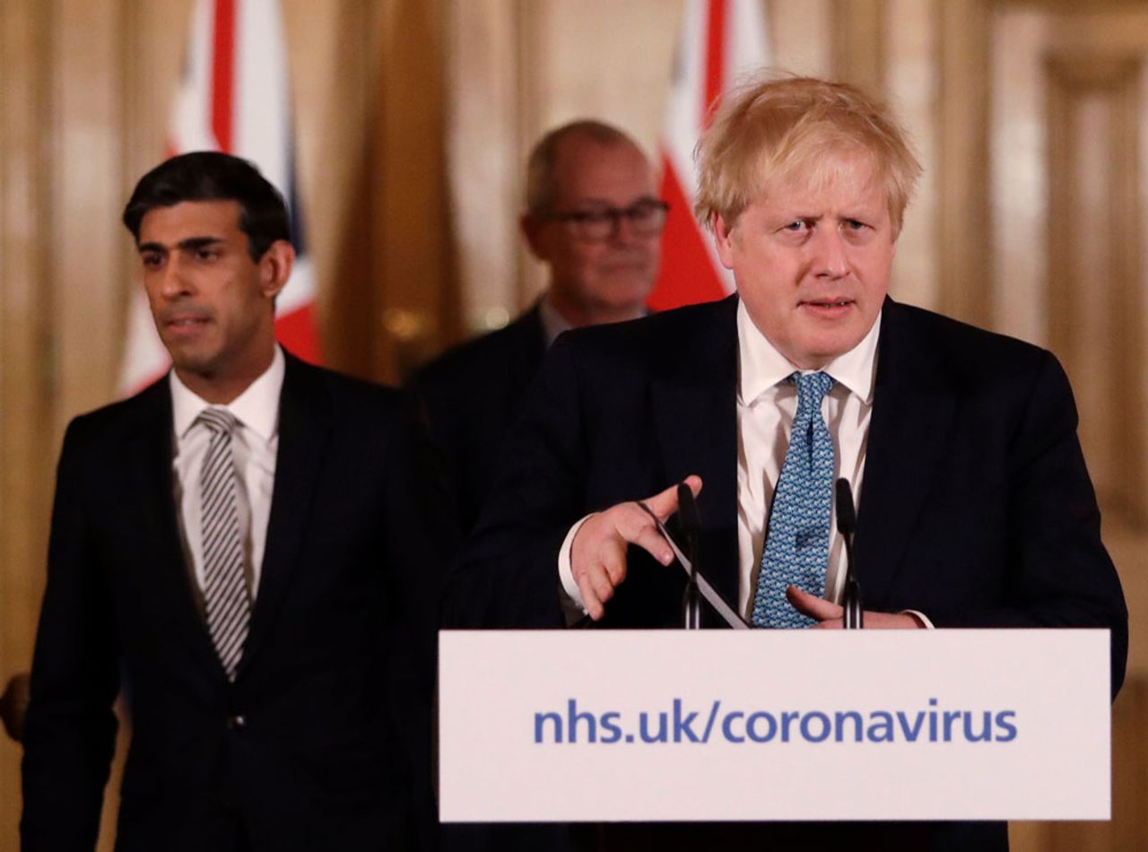 In this file photo from March 17, Prime Minister Boris Johnson arrive for a coronavirus news briefing at 10 Downing Street in London.