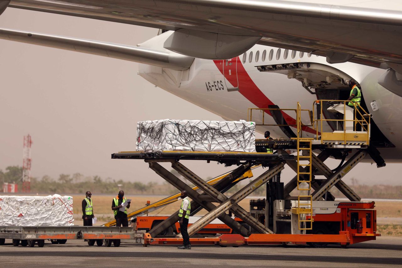 The first batch of Oxford-AstraZeneca Covid-19 vaccine doses are offloaded from a plane at  Nnamdi Azikiwe International Airport in Abuja, Nigeria, on March 2. 