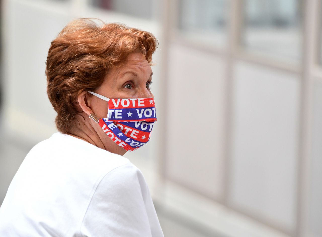 Former Clark County Democrats Chairwoman Donna West looks on as an observer as Clark County election workers scan mail-in ballots at the Clark County Election Department on October 20, in North Las Vegas, Nevada.