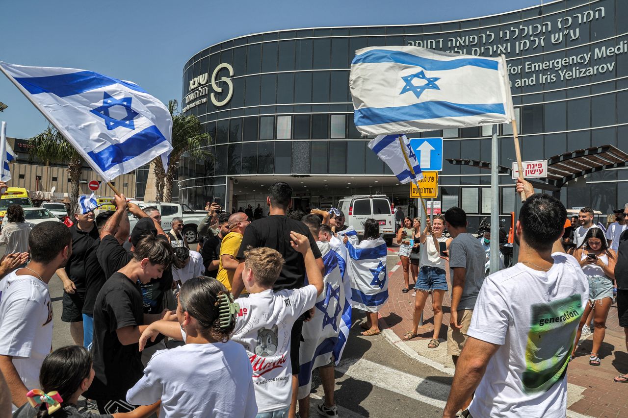 People celebrate outside Sheba Hospital in Ramat Gan, Israel, on Saturday.