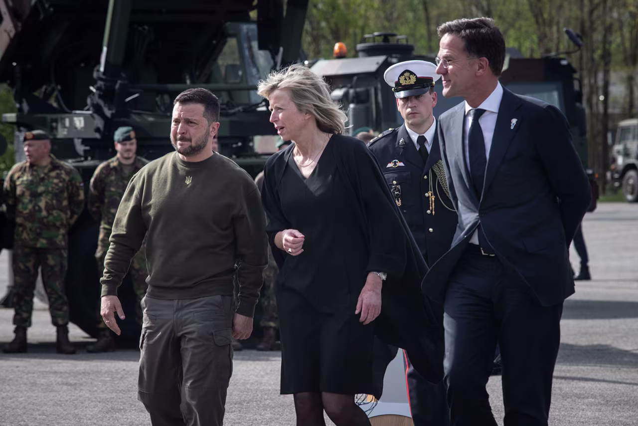 Ukrainian President Volodymyr Zelensky, Dutch defense minister Kajsa Ollongren and Netherlands Prime Minister Mark Rutte walk during a visit to a military base in Soesterberg, Netherlands, on Thursday, May 4.