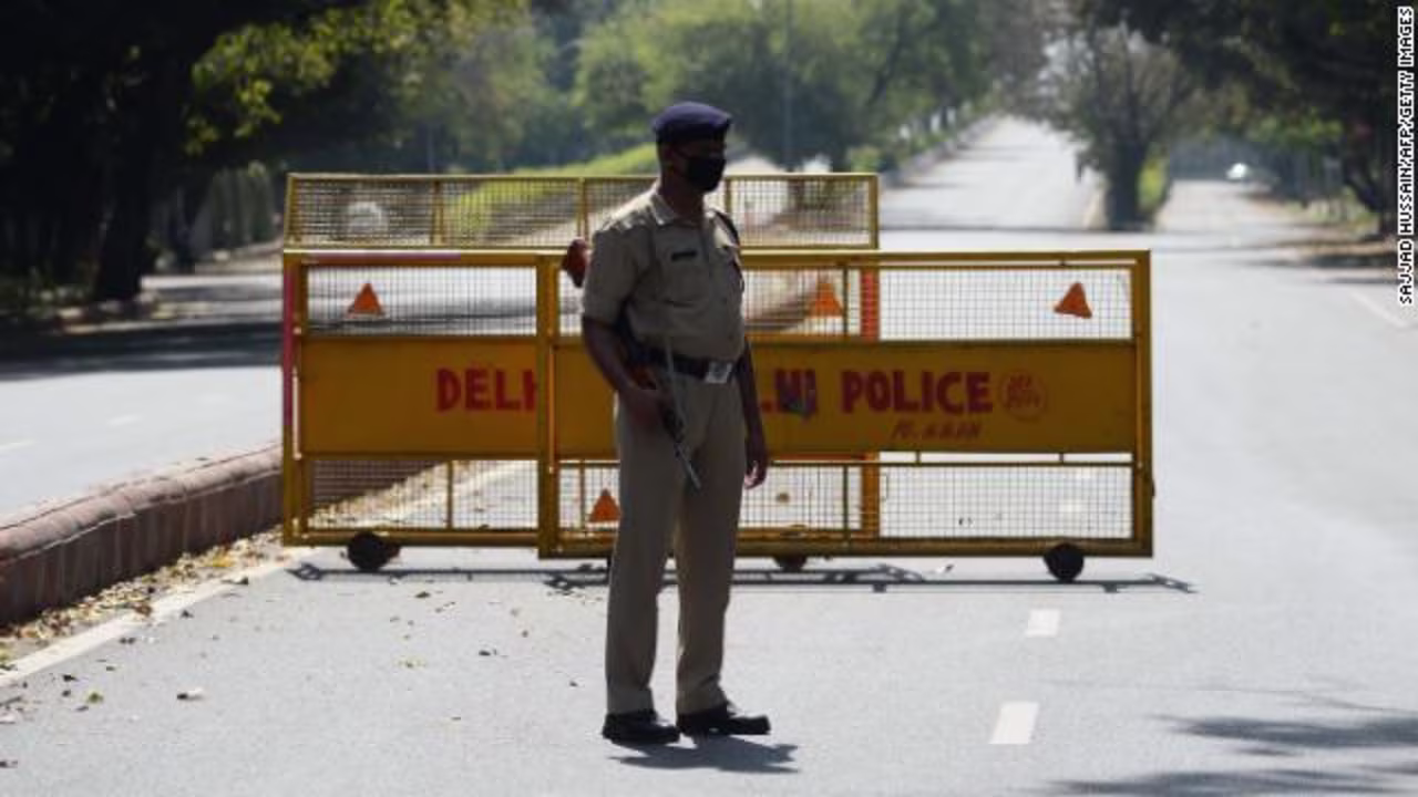 A policeman stands guard at a road checkpoint in New Delhi on March 25, as India's lockdown begins.
