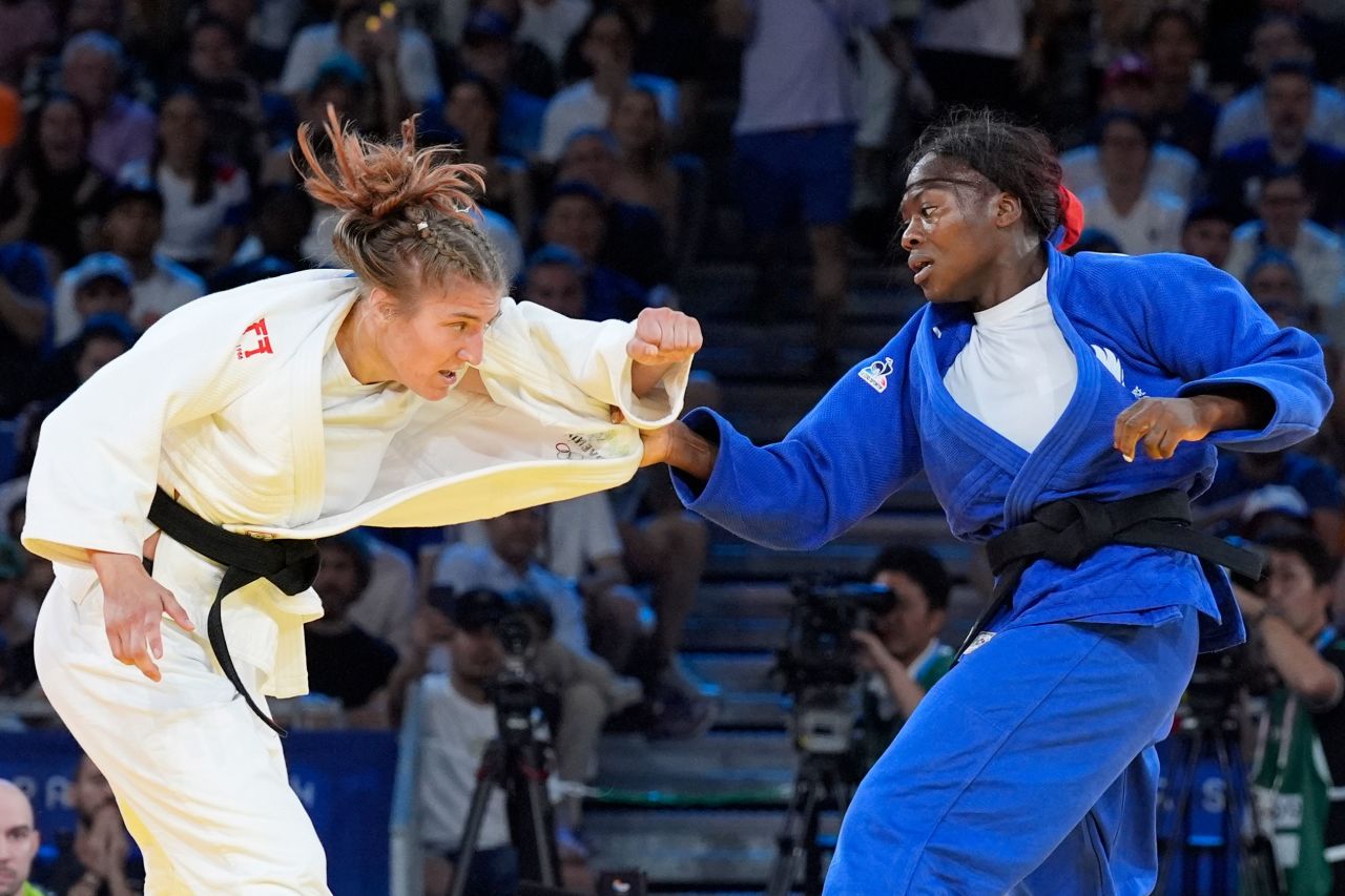 Slovenia's Andreja Leski, left, and France's Clarisse Agbegnenou compete during the women's judo -63kg class semifinal on Tuesday.