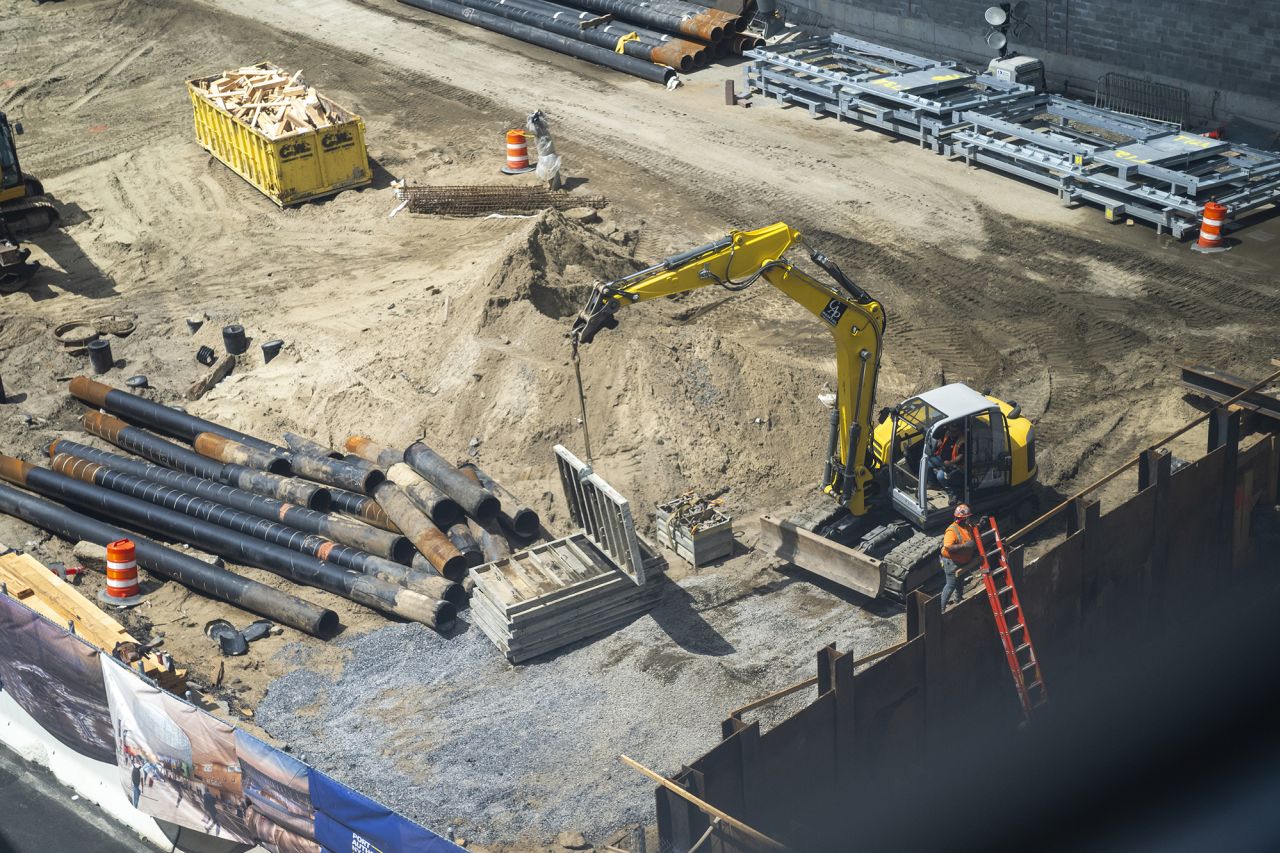 Construction workers build a new structure near Terminal 5 at JFK airport in New York on May 28. 