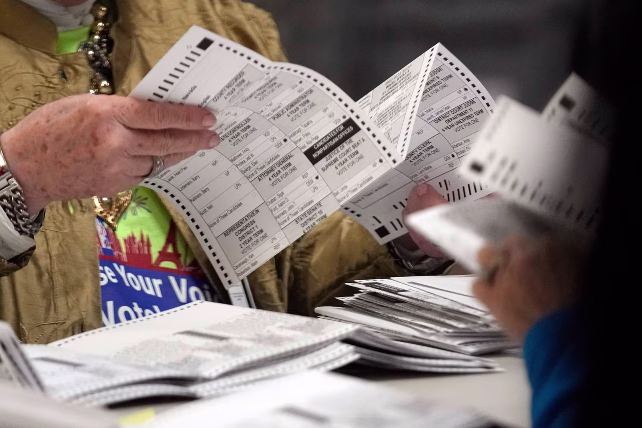 Election workers process ballots at the Clark County Election Department on November 10 in Las Vegas.
