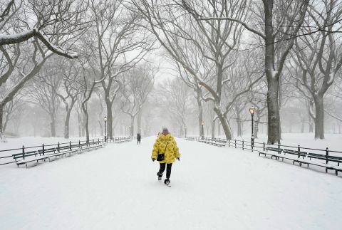  A woman walks in Central Park on Monday.
