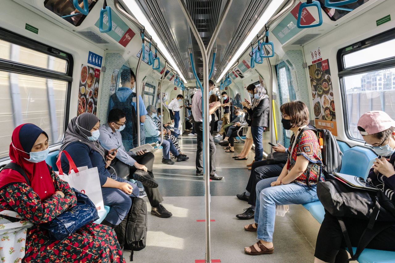 People ride a train in Kuala Lumpur, Malaysia, on September 28.