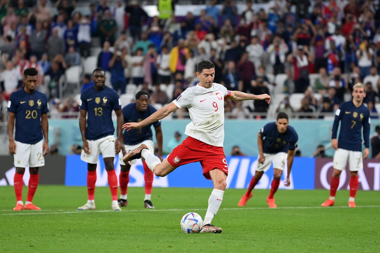 Poland’s Robert Lewandowski scores the team's first goal off a penalty against France on Sunday, December 4. 