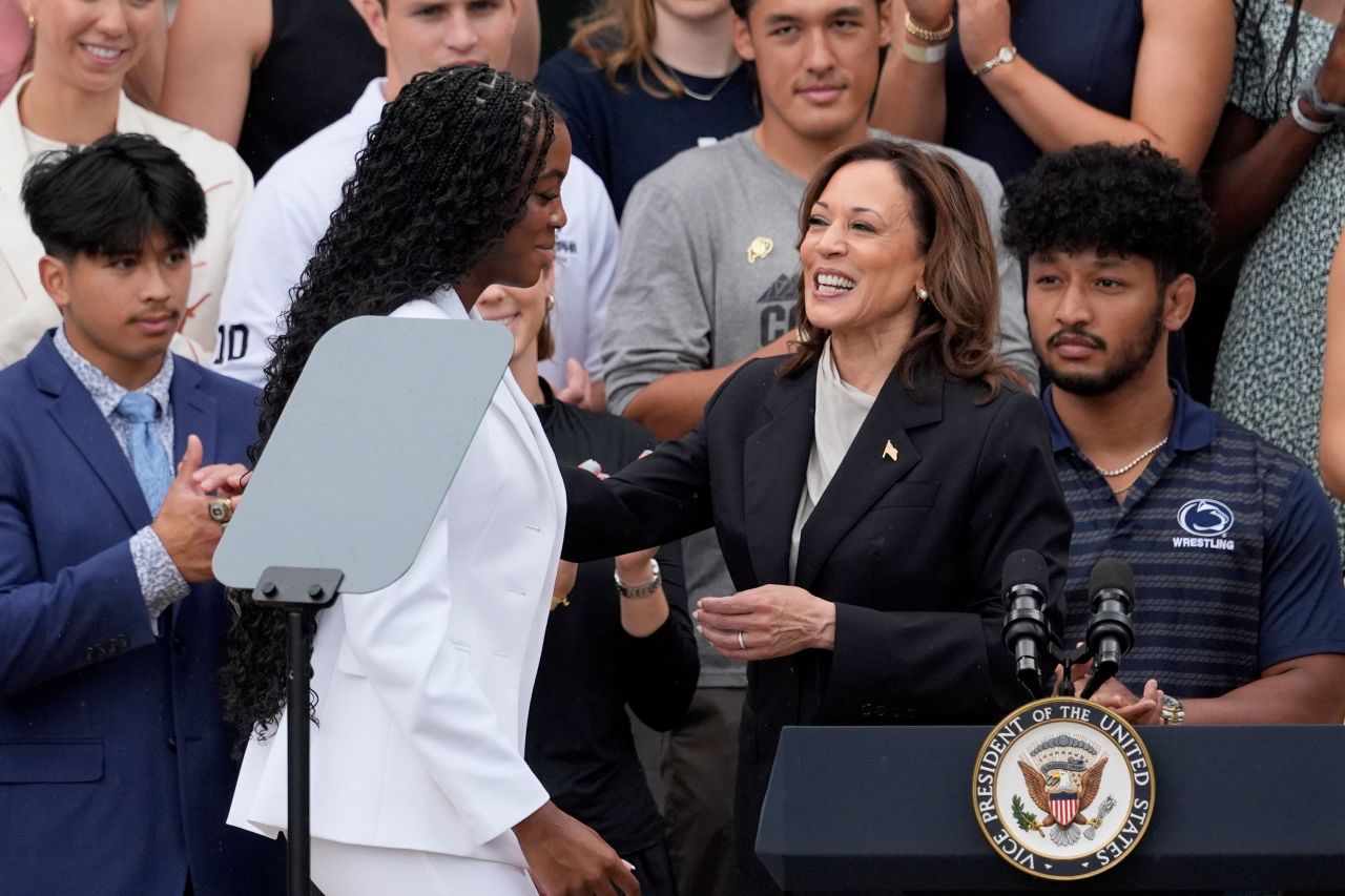 Vice President Kamala Harris welcomes NCAA champion soccer player Jordynn Dudley to the stage on the South Lawn of the White House on Monday.