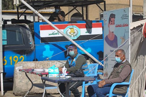 Iraqi health personnel work at a mobile Covid-19 testing unit at Baghdad's Shorja market on February 22.