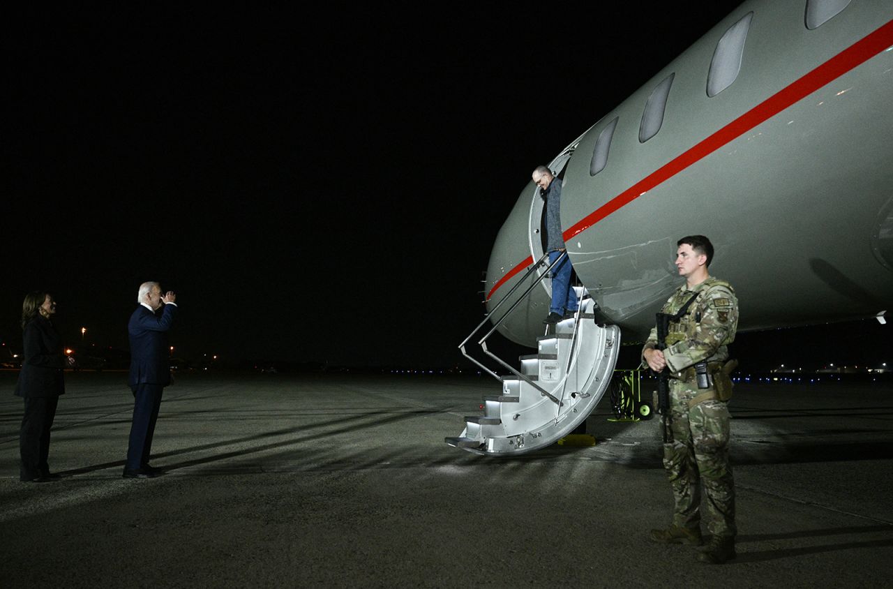 US President Joe Biden and Vice President Kamala Harris greet Paul Whelan at Joint Base Andrews on Thursday.