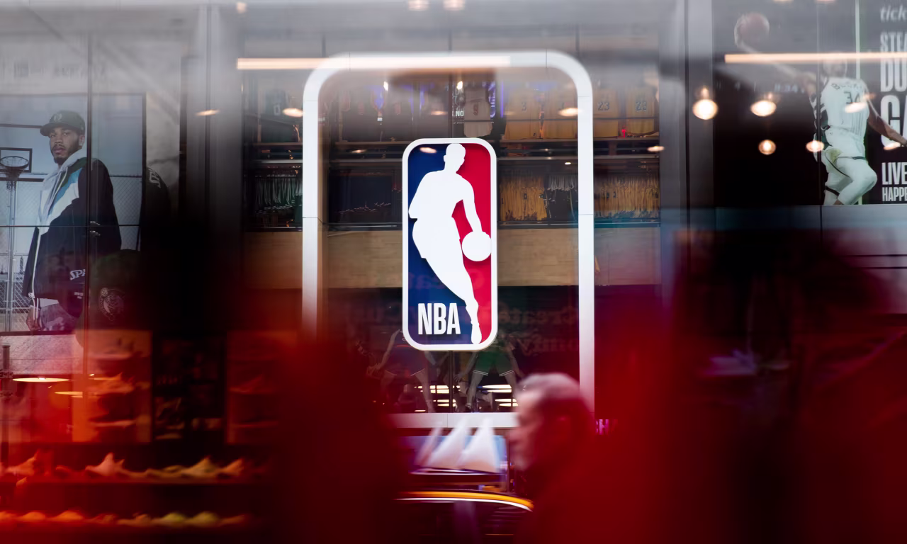 Pedestrians walk past an NBA store in New York City.