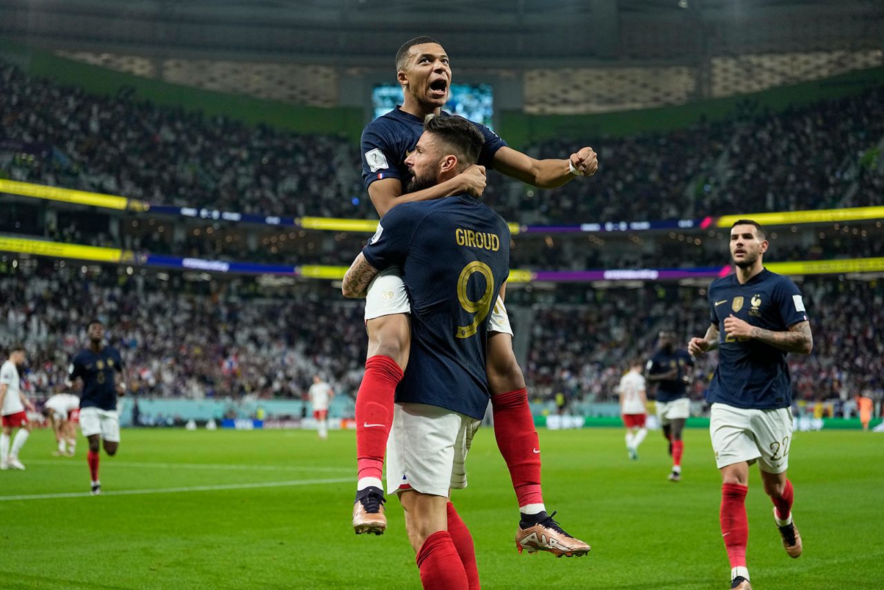 Kylian Mbappe celebrates after Olivier Giroud scored France’s first goal against Poland on Sunday. 