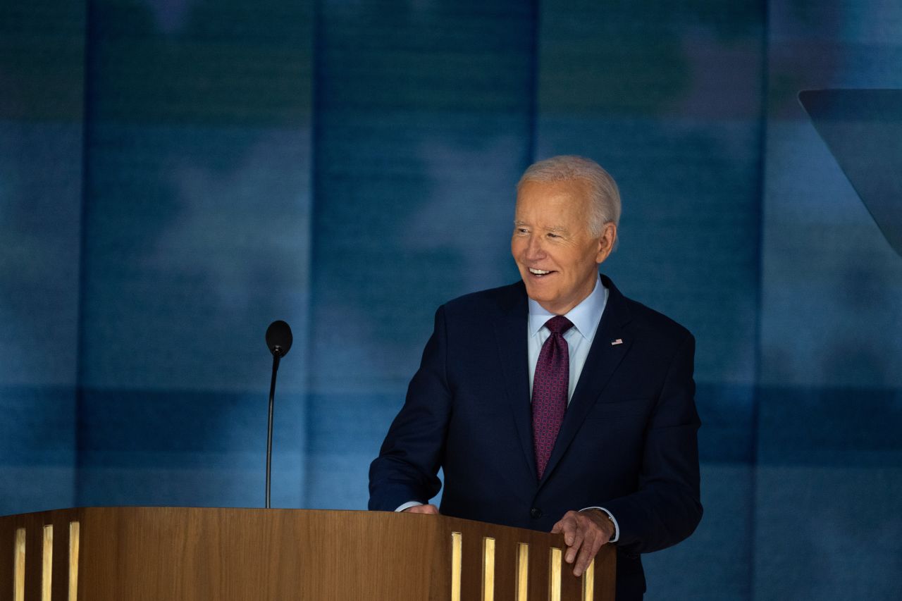 President Joe Biden stands on the stage on Day one of the Democratic National Convention (DNC) in Chicago, on August 19.