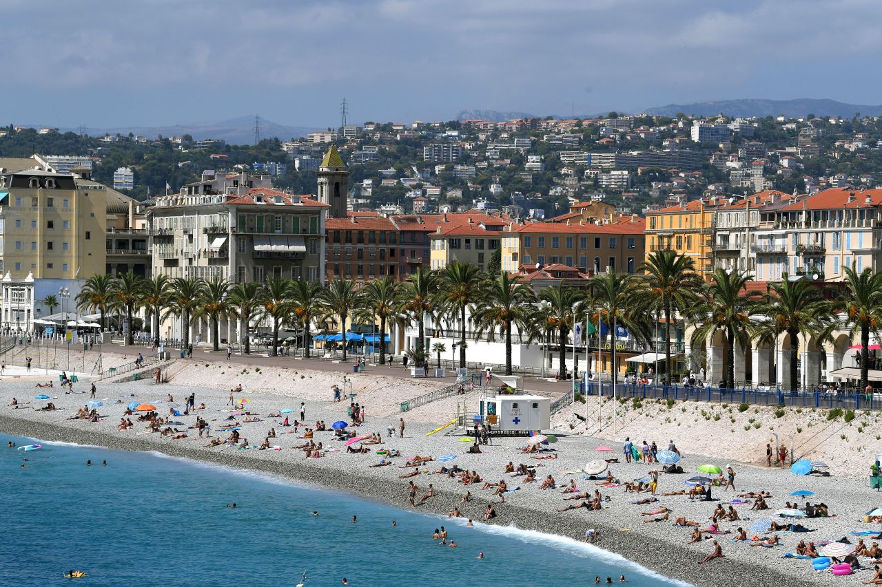 People visit a beach in Nice, France, on August 27.