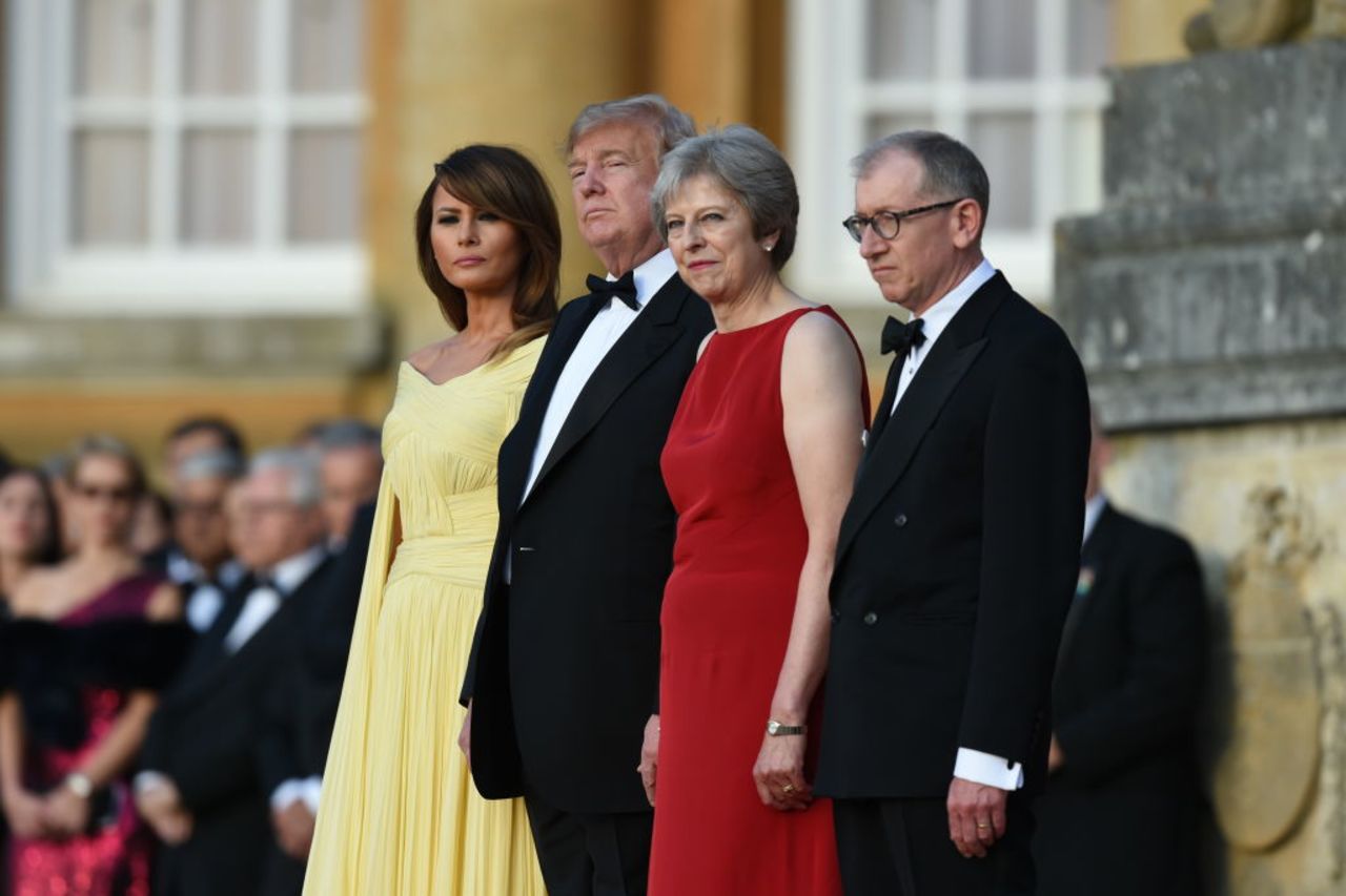 British Prime Minister Theresa May and her husband Philip May greet US President Donald Trump and First Lady Melania Trump at Blenheim Palace on July 12, 2018. 