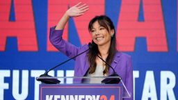 Nicole Shanahan waves from the podium during a campaign event for presidential candidate Robert F. Kennedy Jr. on Tuesday in Oakland, California.