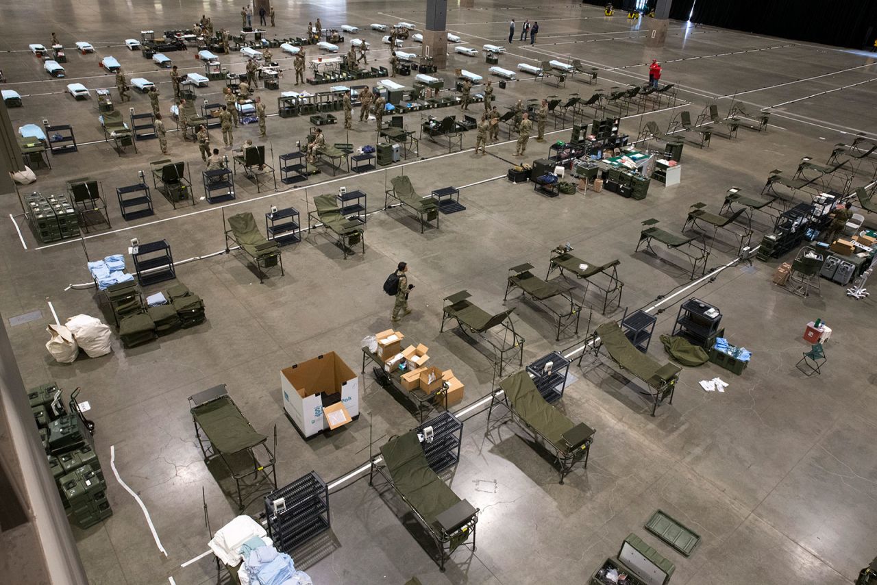 Military personnel set up a field hospital at CenturyLink Event Center on March 31.