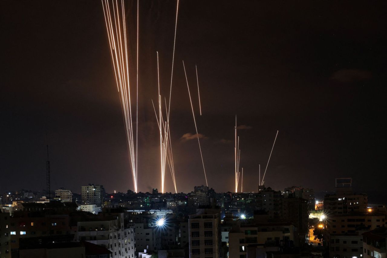 A salvo of rockets is fired by Palestinian militants from Gaza City toward Israel on October 7, 2023.