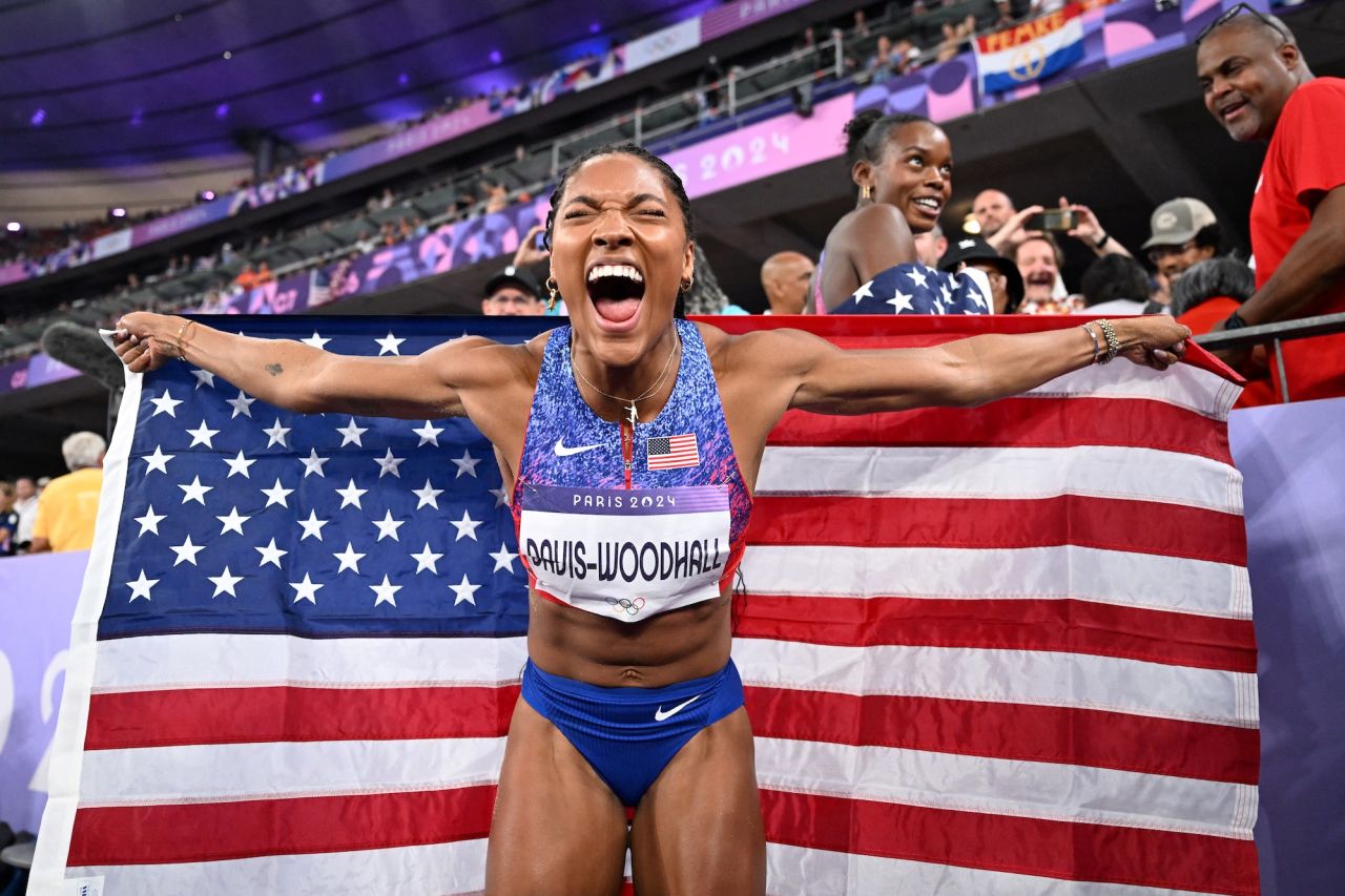 Gold medallist Tara Davis-Woodhall celebrates winning the women's long jump final at Stade de France in Saint-Denis.