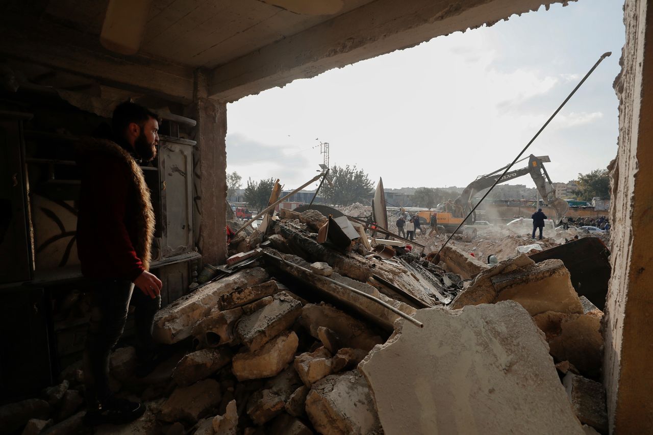 Rescue teams search through the wreckage of collapsed buildings in Aleppo, Syria, on February 7.