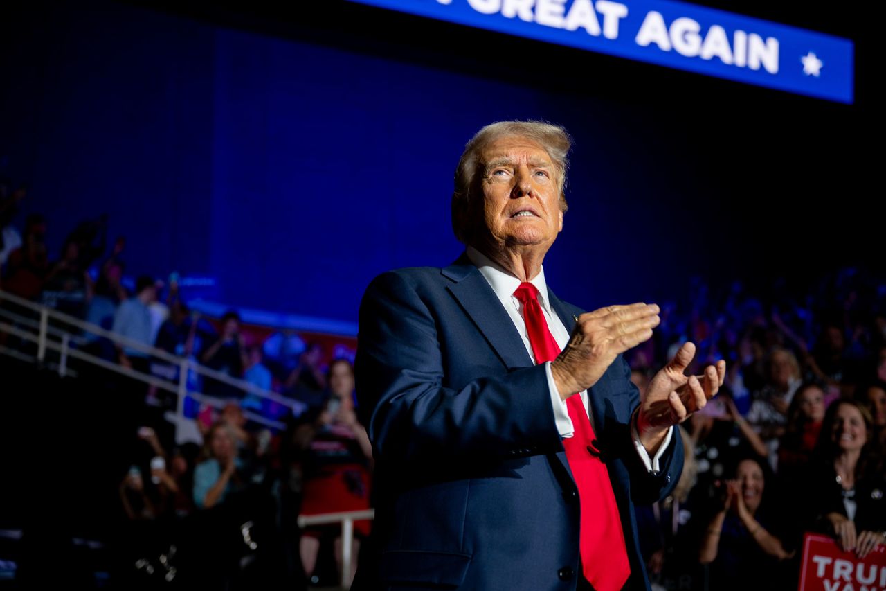 Former President Donald Trump greets attendees upon arrival at his campaign rally at the Bojangles Coliseum on July 24 in Charlotte, North Carolina.