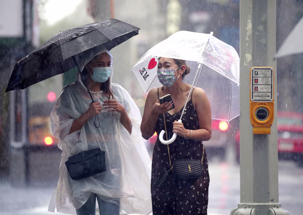 People walk through Times Square in New York on August 22, 2021.