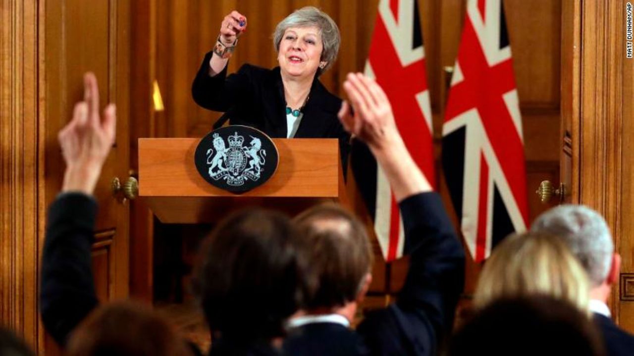 Theresa May stands by her Brexit plan in front of gathered reporters. 