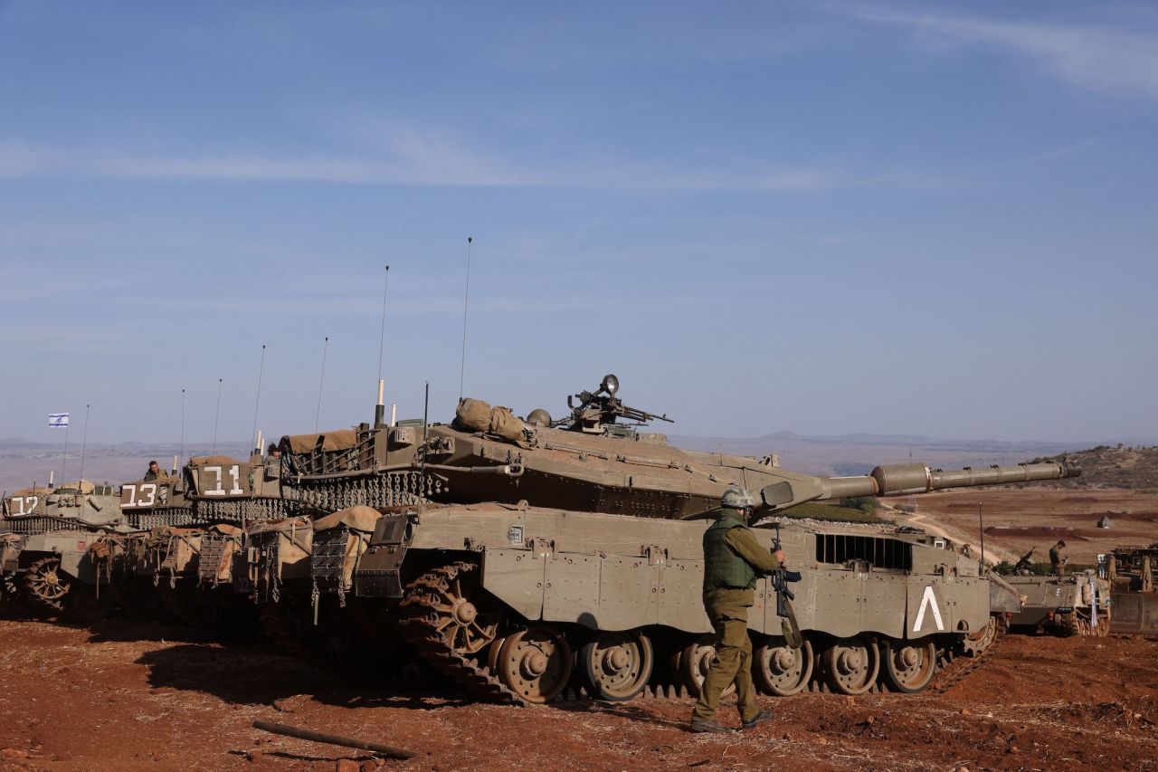 Israeli tanks are lined up during in a military drill near the border with Lebanon in northern Israel on Thursday.