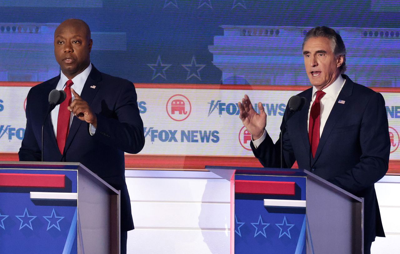 Republican presidential candidate and North Dakota Gov. Doug Burgum, right, participates in the first debate of the GOP primary season hosted by FOX News at the Fiserv Forum on August 23, 2023 in Milwaukee, Wisconsin. 