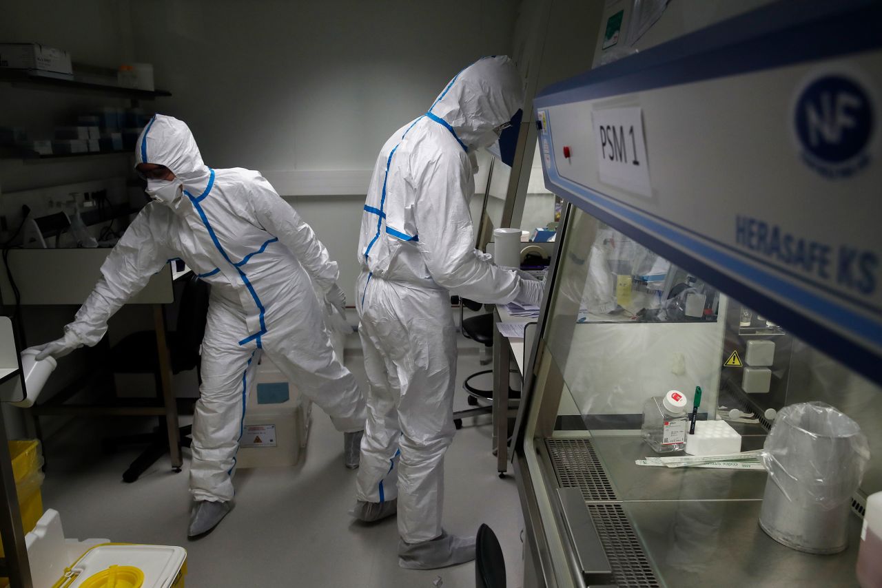 Scientists at the Pasteur Institute in Paris test samples from infected patients.