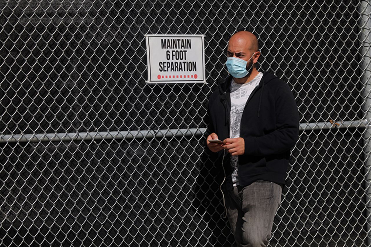 A person waits in line to be tested for COVID-19 at a city test site in the Brooklyn neighborhood of Borough Park on October 05, 2020 in New York City. 