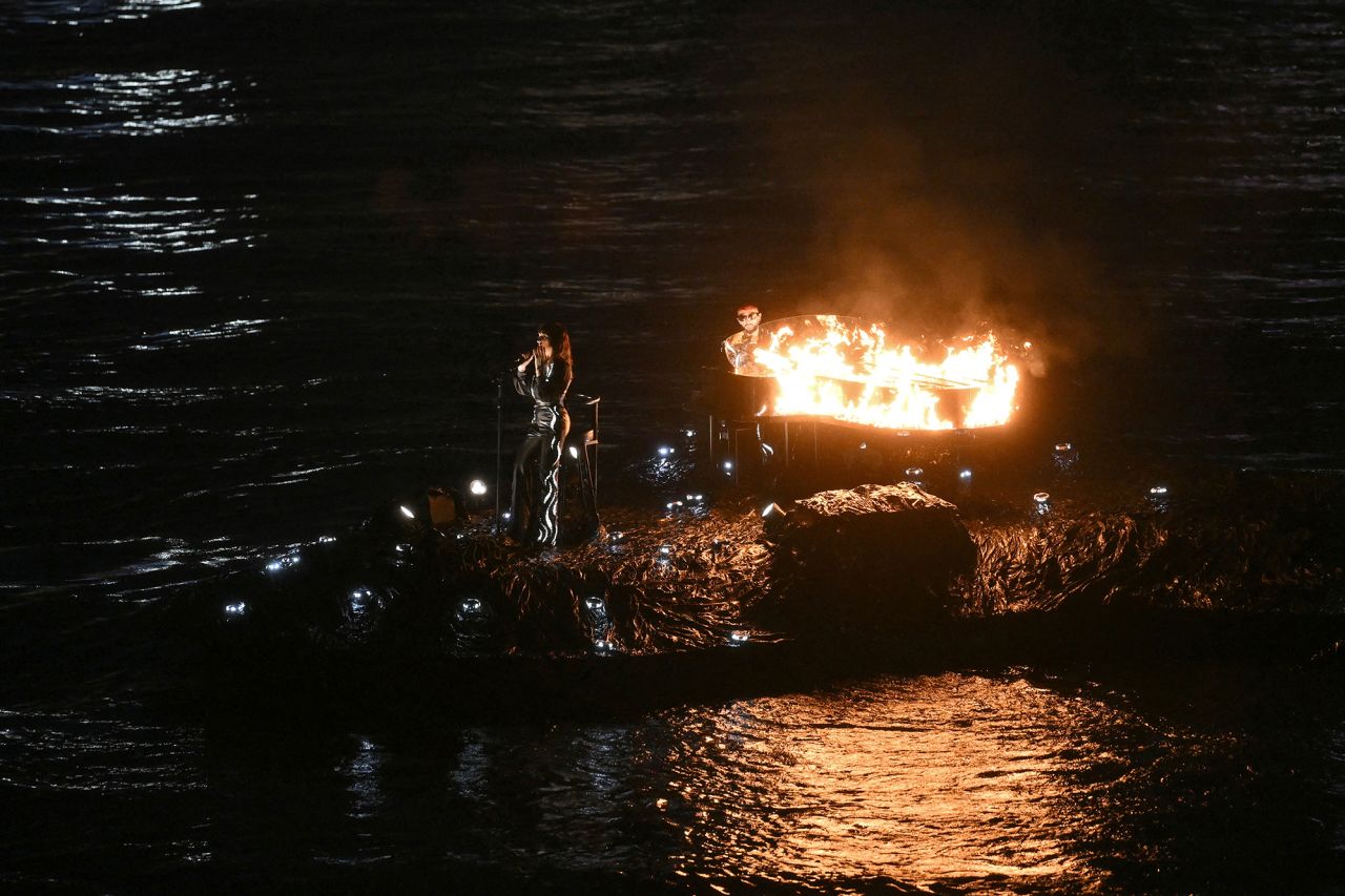 French singer Juliette Armanet and French pianist Sofiane Pamart perform as they sail in a boat along the river Seine 