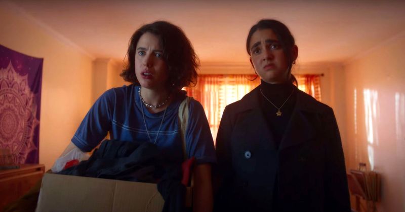 Jamie (played by Margaret Qualley) and Marian (played by Geraldine Viswanathan) are pictured in 'Drive-Away Dolls.'