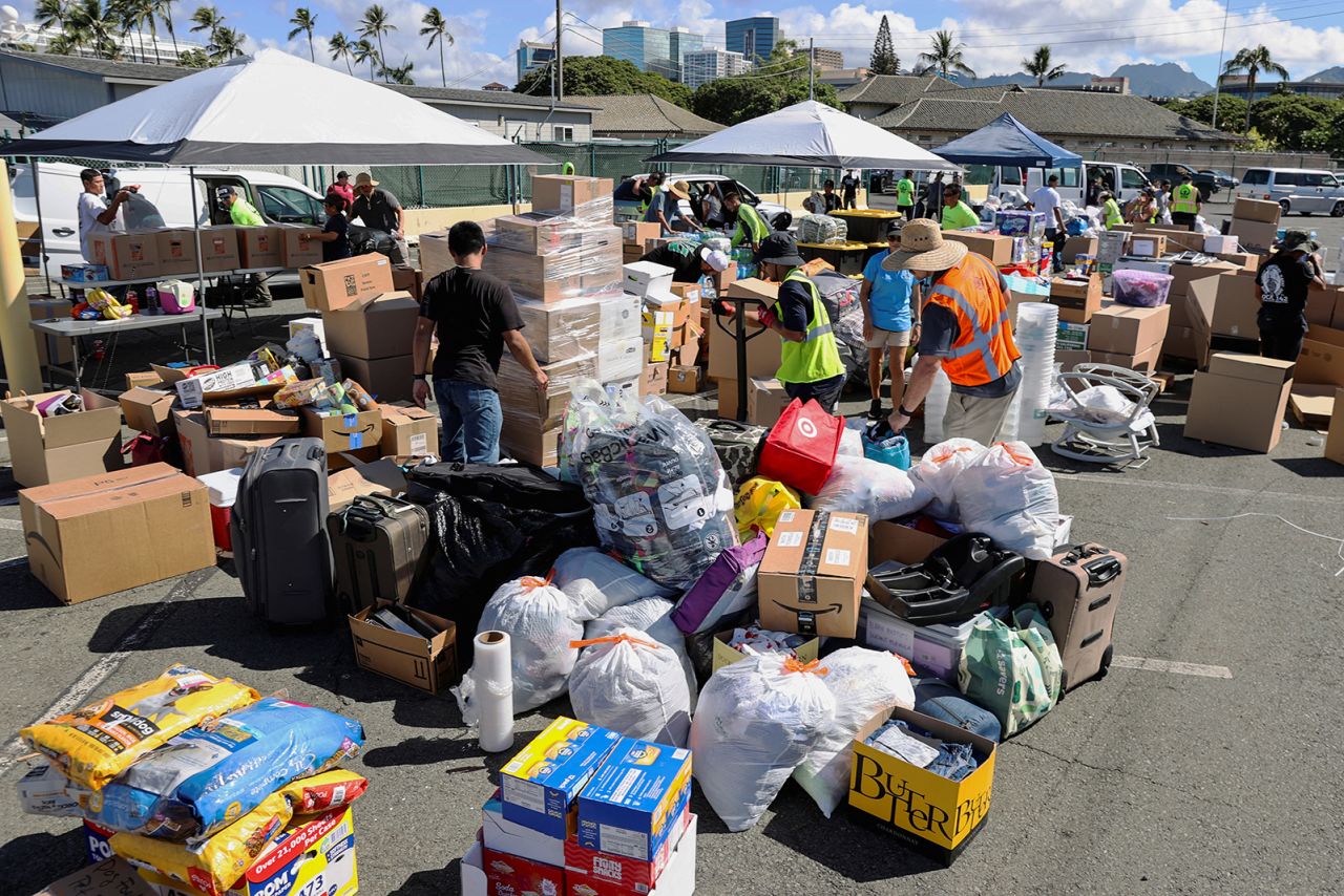 Volunteers prepare donations for the victims of the Maui wildfires, in Honolulu, Hawaii, on August 12. 