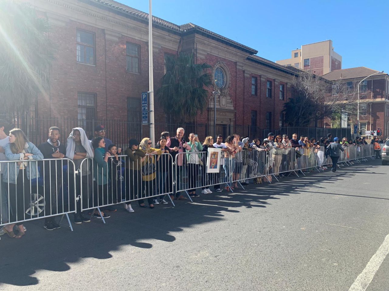 Crowds wait for a glimpse of the royal couple. 