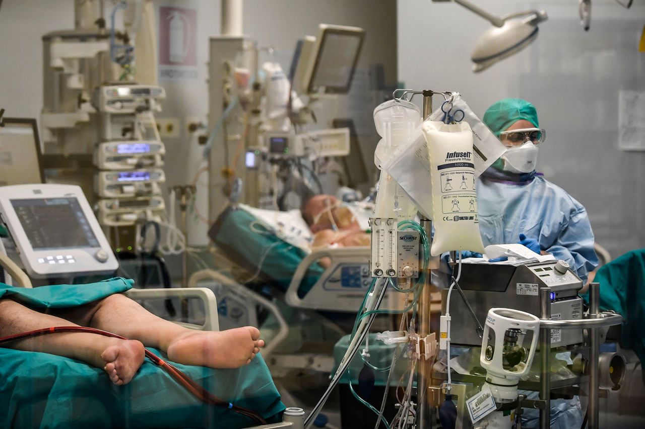 A doctor at San Matteo Hospital in Pavia, Italy, treats coronavirus patients on Thursday, March 26.