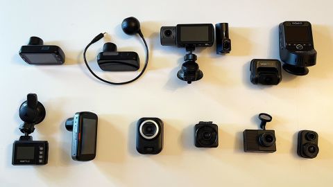 Full group of 10 dash cams displayed on a white tabletop.