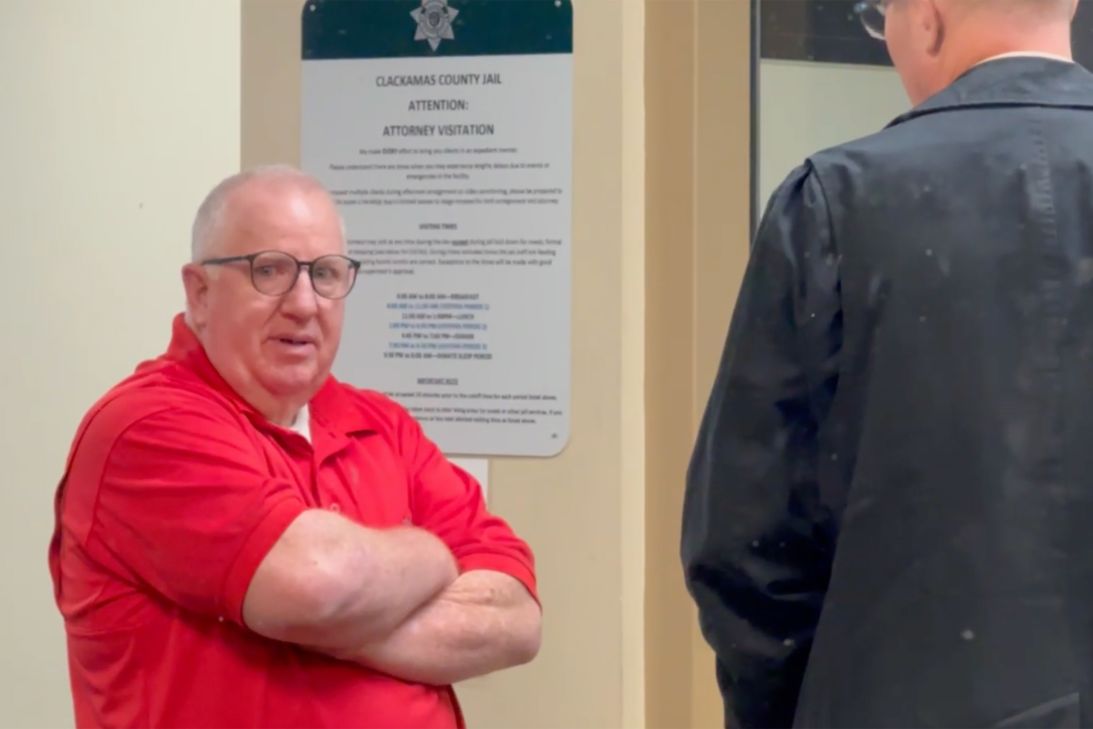 Former doctor David B. Farley is seen here reporting Friday morning to Clackamas County jail in Oregon, where he turned himself in. He was arraigned later in the day on sexual abuse charges.