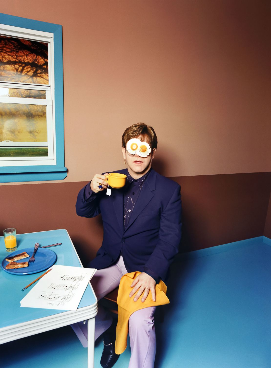 Elton even features in some of his own collection, as shown in David LaChapelle's "Elton John, Egg On His Face," 1999.