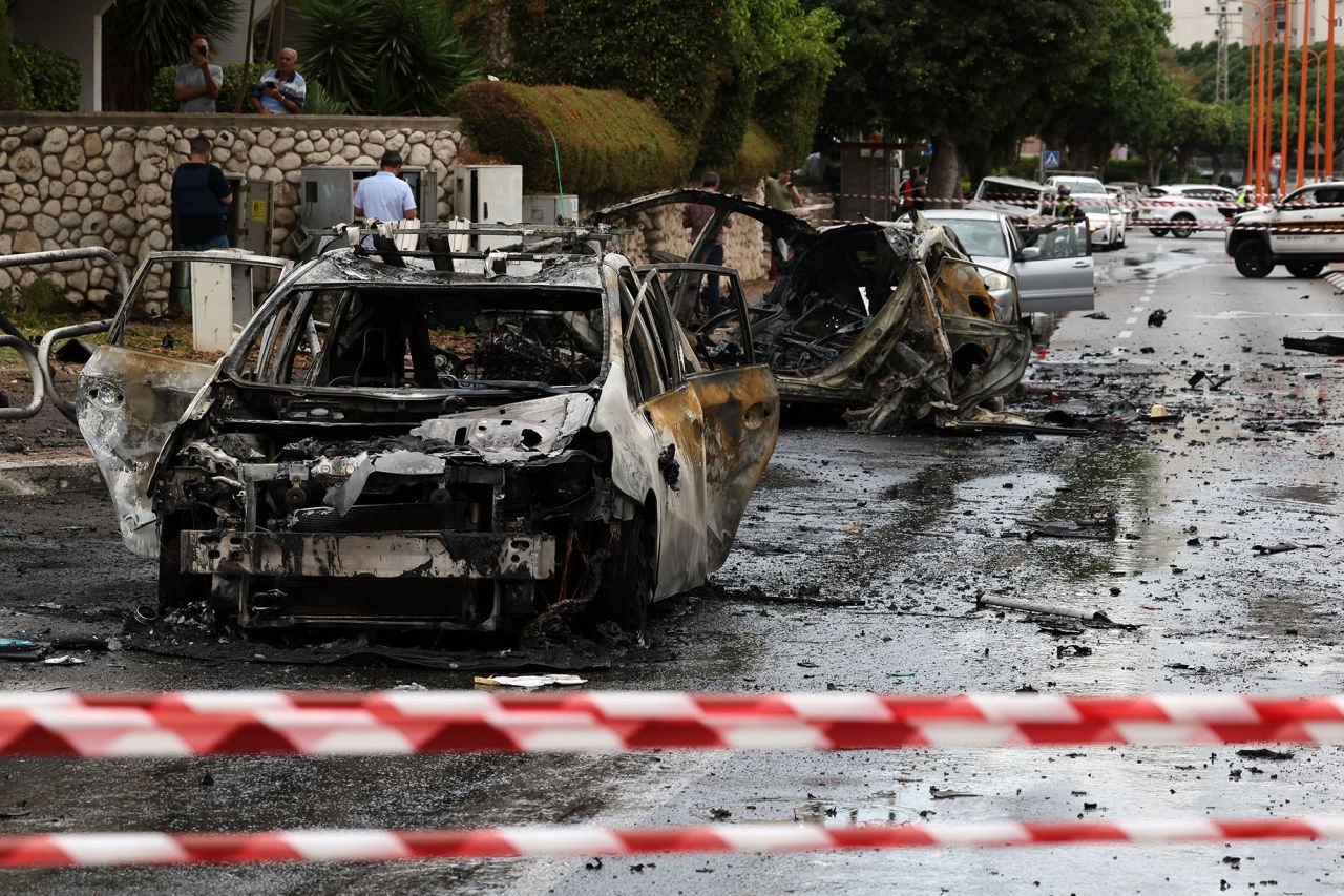 Israeli emergency responders cordon off the site of a rocket attack in the southern Israeli city of Ashdod on October 9.