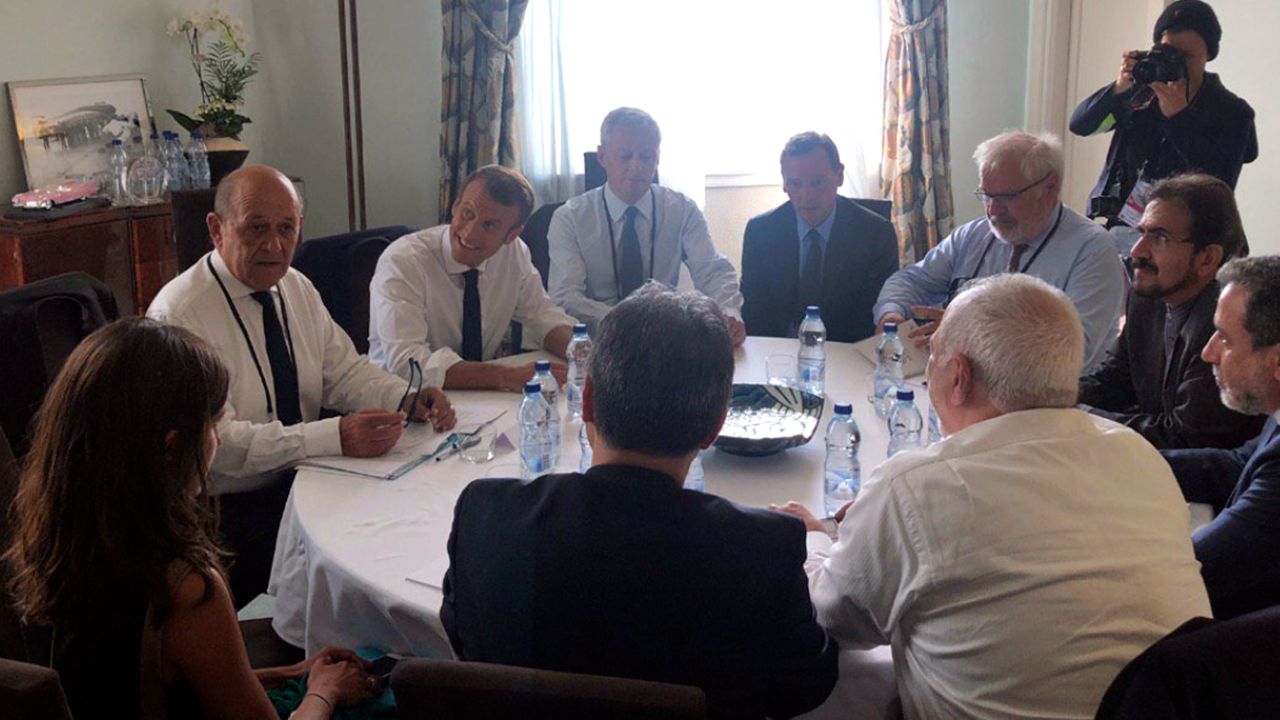 Macron and the French Foreign Minister Jean-Yves le Drian, second left, meeting Zarif, bottom right.