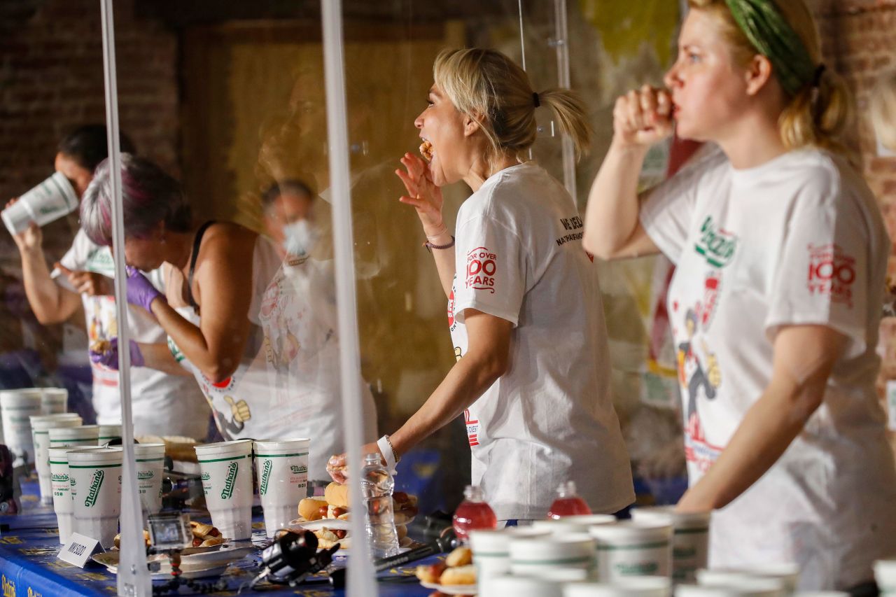 Competitive eater Miki Sudo, center, competes in the women's division of the Nathan's Famous July Fourth hot dog eating contest on July 4 in New York. 