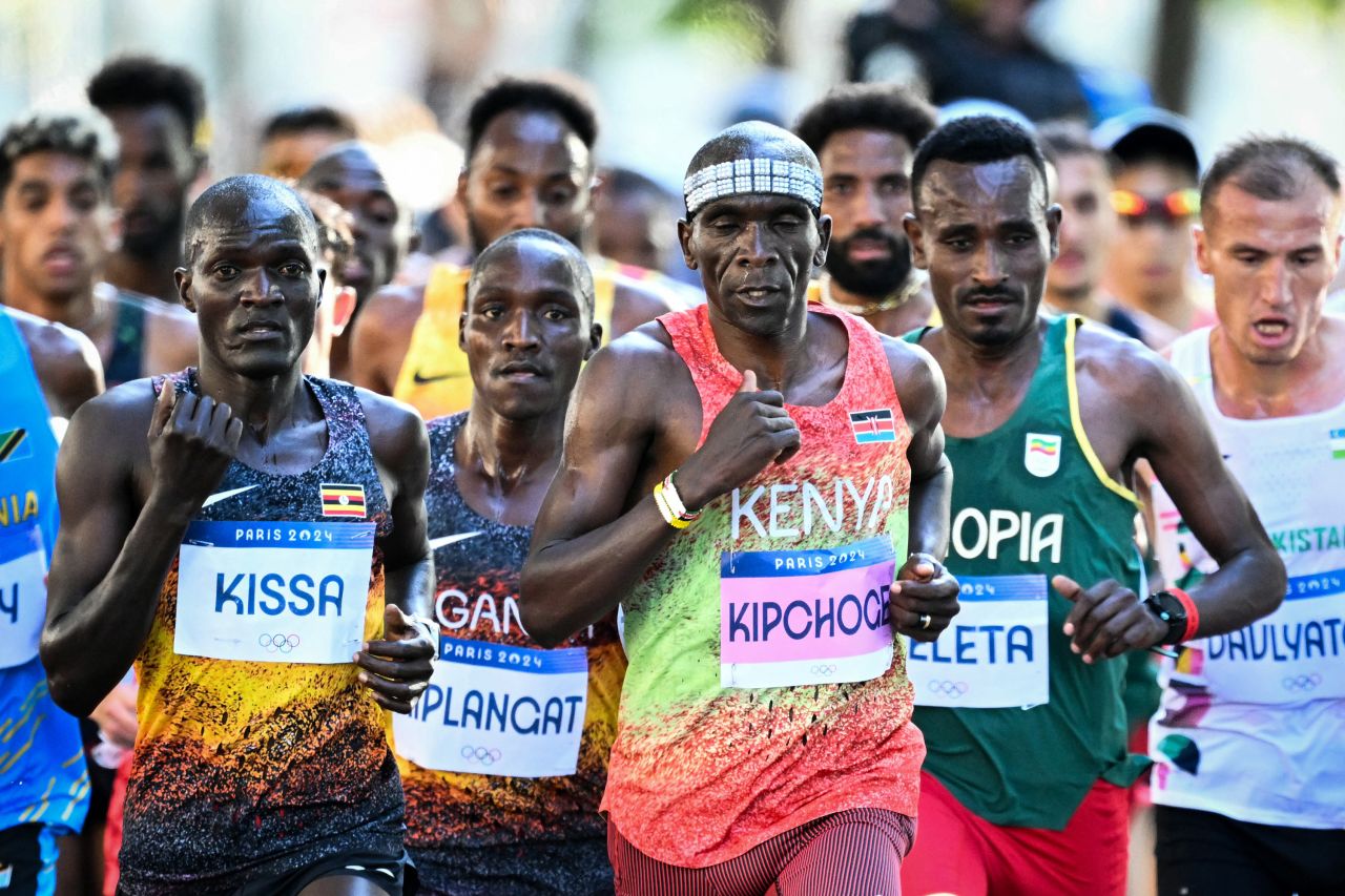 Kenya's Eliud Kipchoge, center, and other athletes compete in the men's marathon on August 10. 