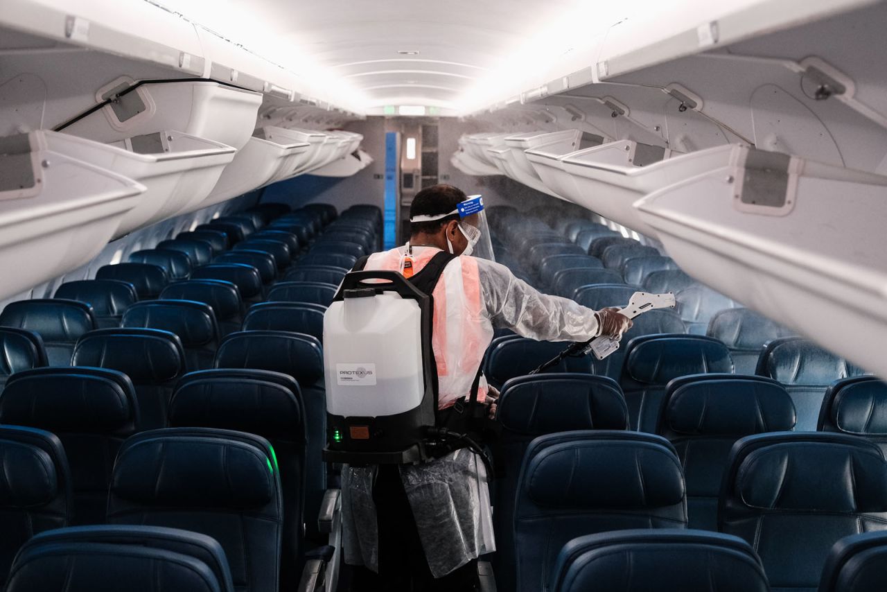 A airport employee performs an aircraft disinfecting demonstration during a media preview at the Ronald Reagan National Airport on July 22, in Arlington, Virginia. 