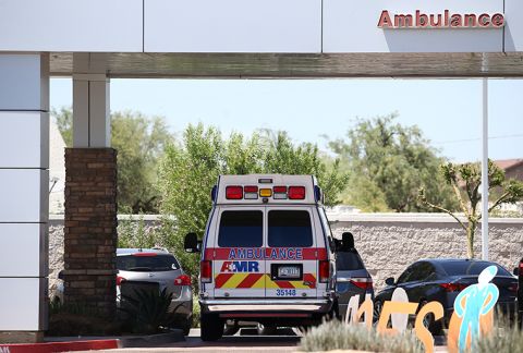 An ambulance is parked at Arizona General Hospital on Wednesday, June 10 , in Laveen, Arizona. The state is dealing with a surge in virus cases and hospitalizations.